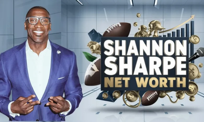 This image features Shannon Sharpe, a former NFL player and well-known sports analyst, wearing a purple suit and glasses, smiling confidently. He is making a double peace sign gesture with both hands. Next to him is a bold graphic with the text "Shannon Sharpe Net Worth" in large white and gold letters. Surrounding the text are various symbols, including footballs, gold coins, a microphone, and an upward arrow on a bar chart, all symbolizing his financial success, media influence, and career in sports. The background is sleek and modern, with a professional aesthetic.