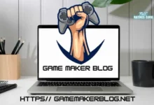 Game Maker Blog logo featuring a raised fist holding a gaming controller displayed on a laptop screen, placed on a desk with a notebook, plant, and coffee mug in the background. The URL https// gamemakerblog.net is shown at the bottom of the image