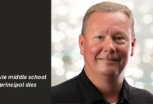 Argyle Middle School Principal Died. A man in a black shirt displaying "Angie Middle School Principal" poses, representing his leadership in the school community.